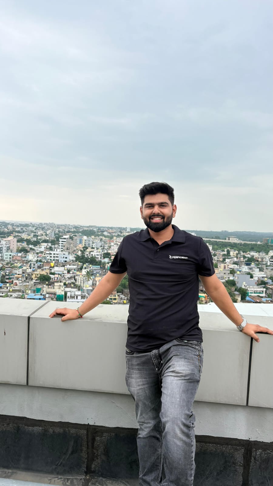 Wishvesh Ujawane smiling on a rooftop above Nagpur, India